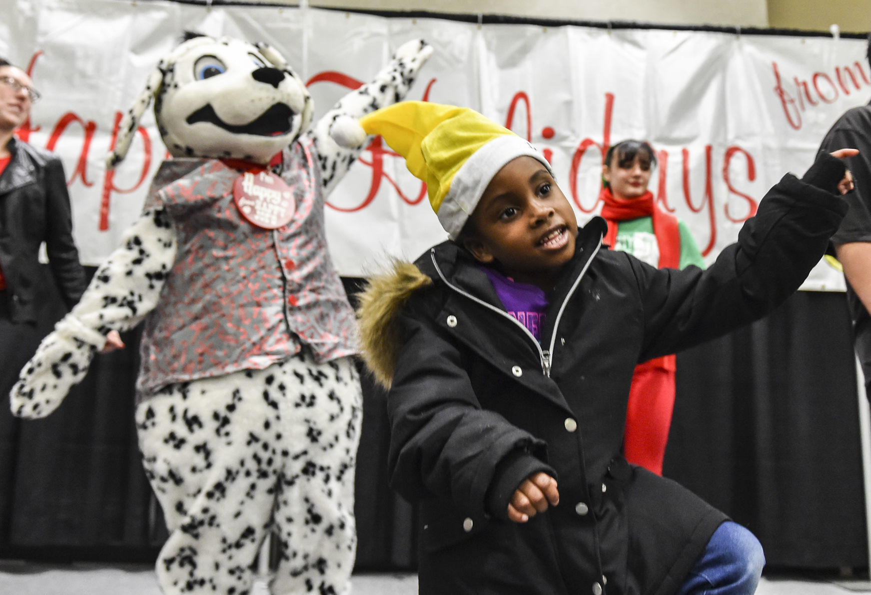 Holiday hugs at annual Happy Joe party